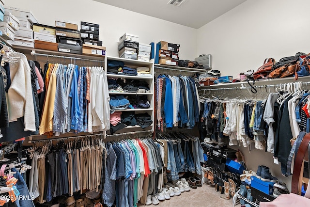 spacious closet with visible vents and carpet flooring