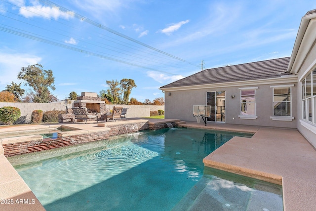 view of swimming pool featuring a patio, an outdoor stone fireplace, fence, and a fenced in pool