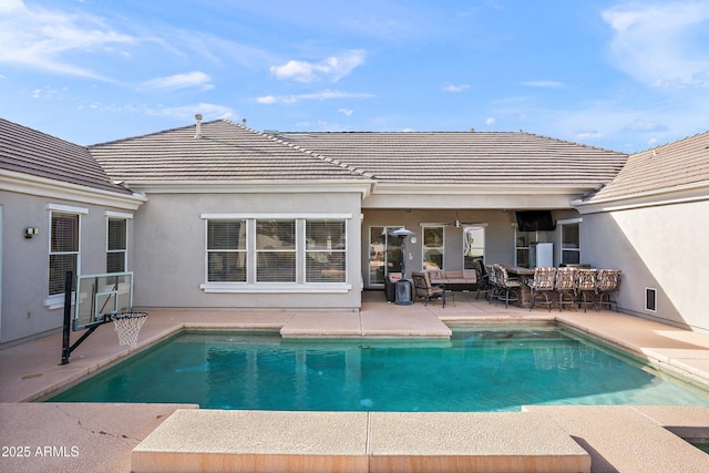 outdoor pool featuring a patio