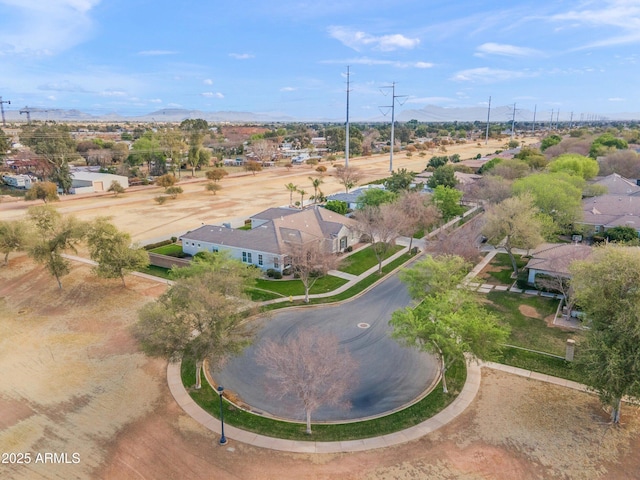 birds eye view of property with a mountain view