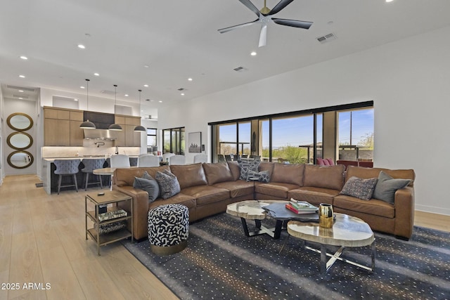 17245 E Desert Vista Trl, Rio Verde, AZ 85263 - living area with light wood-style floors, ceiling fan, recessed lighting, and a high ceiling
