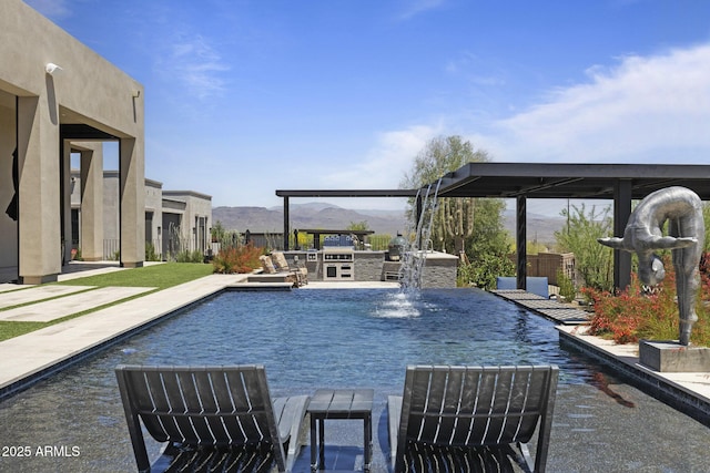 17245 E Desert Vista Trl, Rio Verde, AZ 85263 - outdoor pool featuring area for grilling, a mountain view, and a patio area