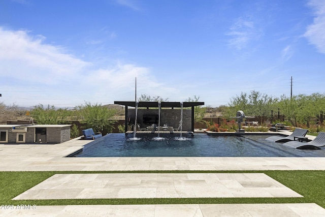 17245 E Desert Vista Trl, Rio Verde, AZ 85263 - swimming pool featuring a patio area and an outdoor kitchen