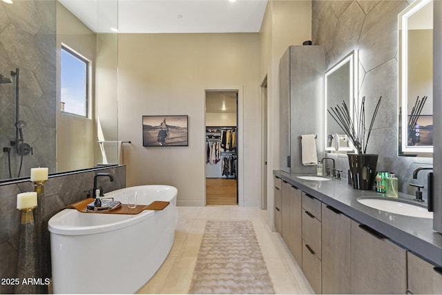 17245 E Desert Vista Trl, Rio Verde, AZ 85263 - full bath featuring tile walls, tiled shower, a soaking tub, double vanity, and a walk in closet