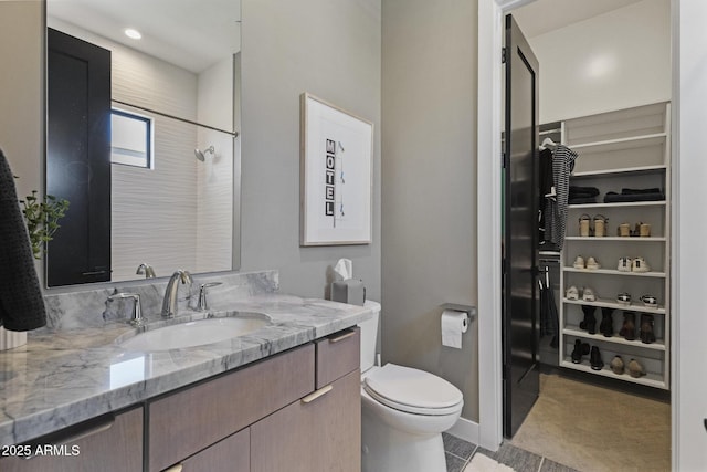 17245 E Desert Vista Trl, Rio Verde, AZ 85263 - full bathroom with vanity, a spacious closet, and toilet