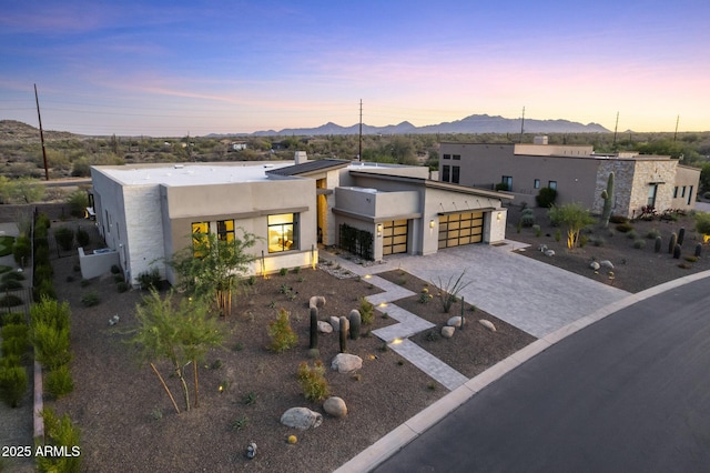17245 E Desert Vista Trl, Rio Verde, AZ 85263 - contemporary home with a mountain view, stucco siding, a garage, and decorative driveway