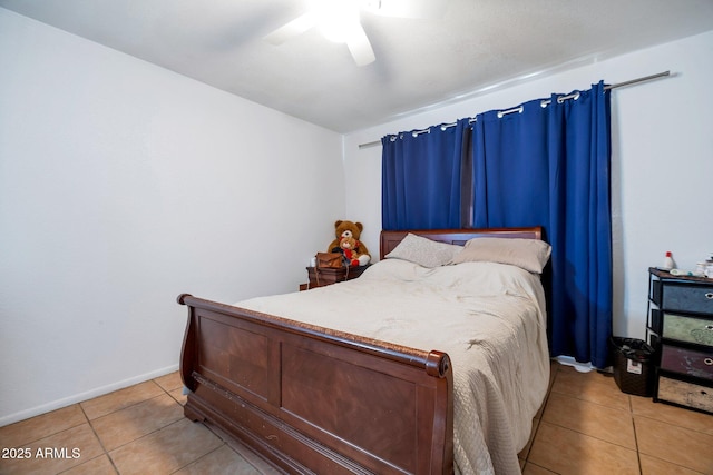 tiled bedroom with ceiling fan