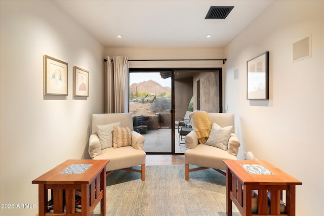 sitting room featuring light wood-type flooring