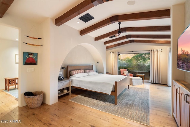 bedroom with access to outside, lofted ceiling with beams, and light wood-type flooring