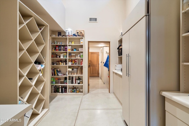 wine room with light tile patterned floors