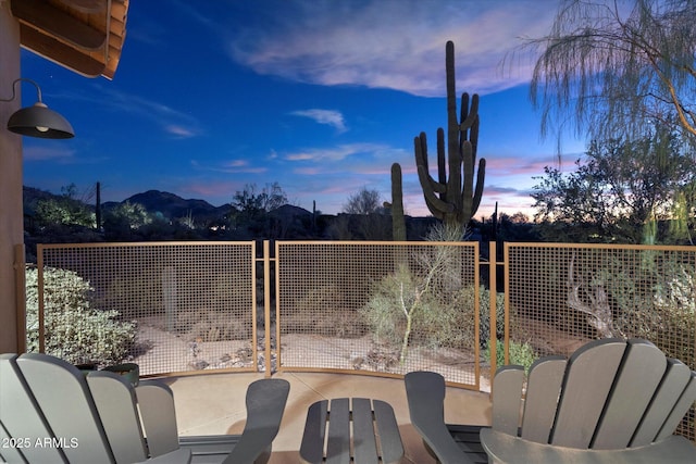 view of patio terrace at dusk