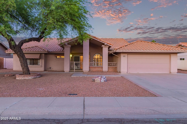 7833 S Kenneth Pl, Tempe, AZ 85284 - mediterranean / spanish home with stucco siding, an attached garage, a tiled roof, and concrete driveway