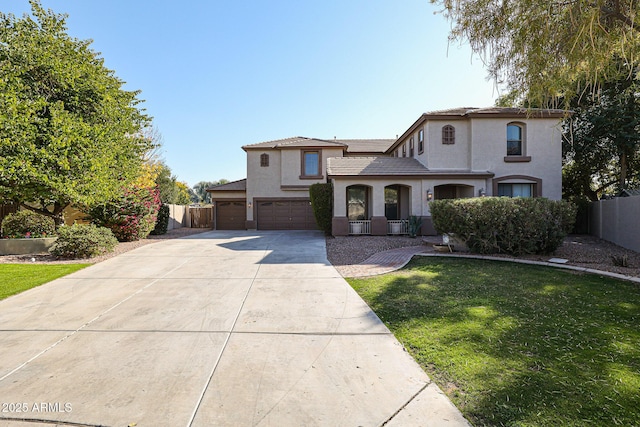 view of front of home with a front lawn and a garage