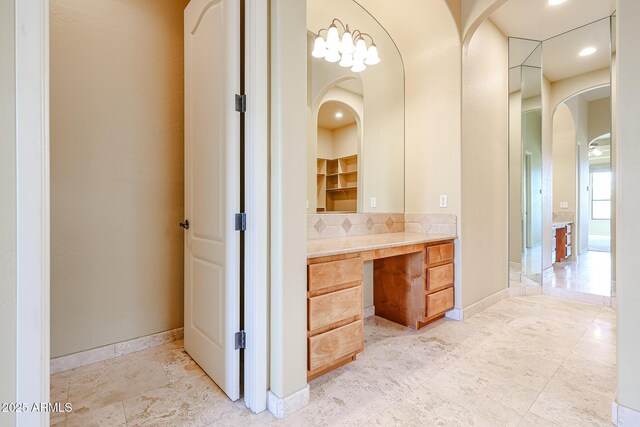 bathroom with tasteful backsplash and vanity