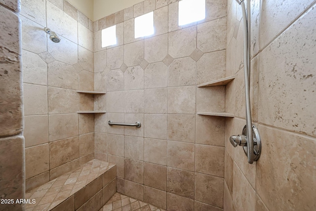 bathroom featuring a tile shower