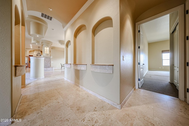 corridor featuring ornamental molding