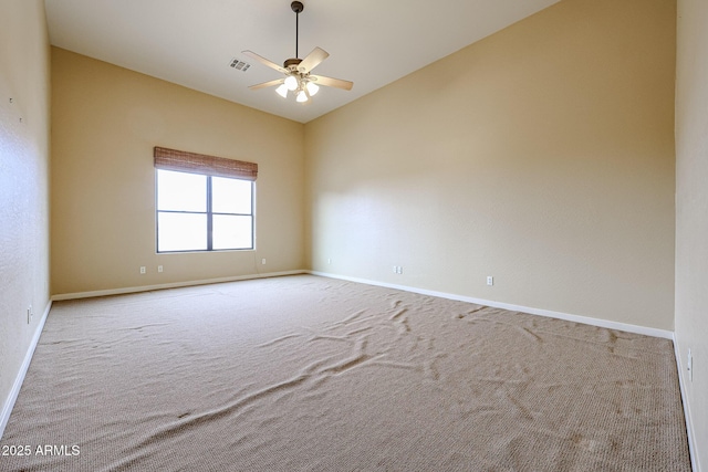 unfurnished room with light carpet, high vaulted ceiling, and ceiling fan