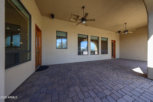 view of patio / terrace featuring ceiling fan