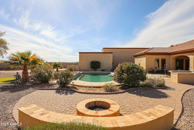 view of swimming pool with a patio area