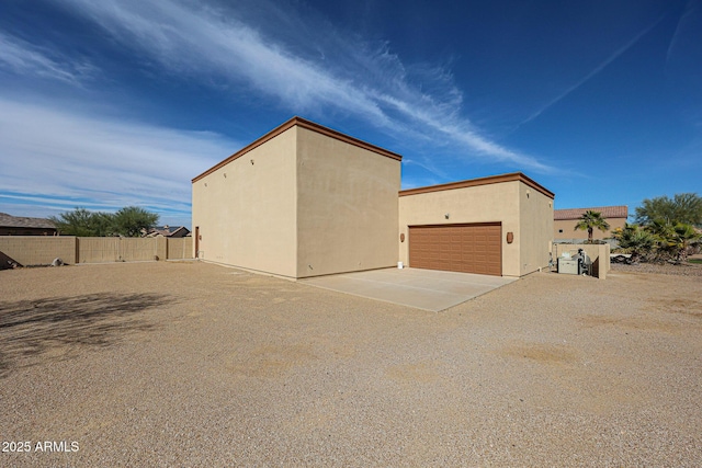 view of property exterior with a garage