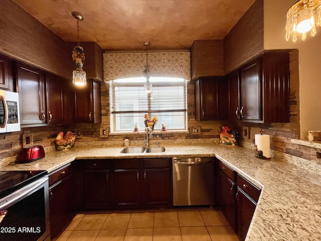 kitchen with dishwasher, white microwave, a sink, light tile patterned floors, and light countertops