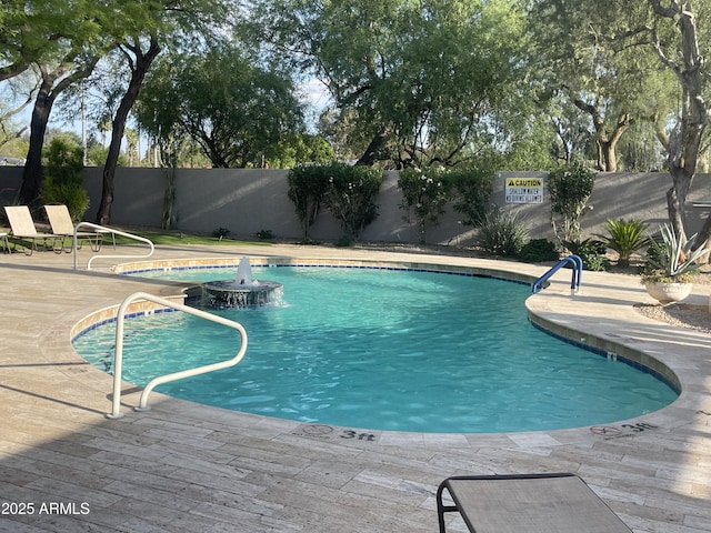 view of pool featuring a fenced backyard and a patio