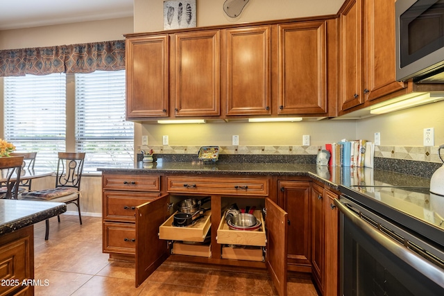 13050 W Pinnacle Vista Dr, Peoria, AZ 85383 - kitchen with black electric range oven and tile patterned floors