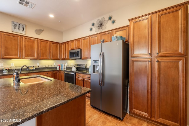 13050 W Pinnacle Vista Dr, Peoria, AZ 85383 - kitchen with sink, stainless steel appliances, dark stone counters, and light tile patterned flooring