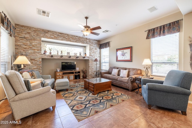 13050 W Pinnacle Vista Dr, Peoria, AZ 85383 - tiled living room featuring ceiling fan and a healthy amount of sunlight