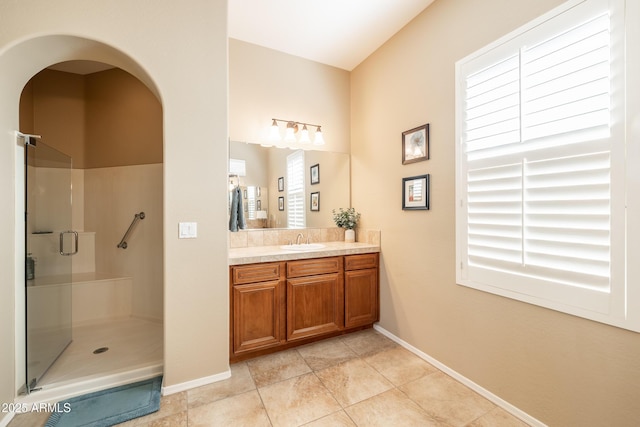 13050 W Pinnacle Vista Dr, Peoria, AZ 85383 - bathroom featuring vanity, tile patterned flooring, and a shower with shower door