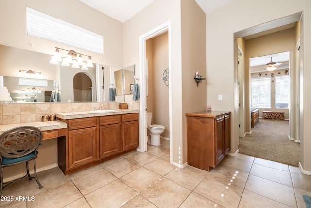 13050 W Pinnacle Vista Dr, Peoria, AZ 85383 - bathroom featuring vanity, ceiling fan, tile patterned floors, and toilet