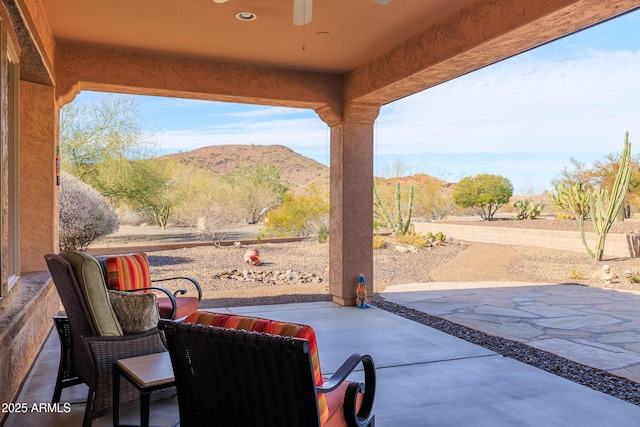 13050 W Pinnacle Vista Dr, Peoria, AZ 85383 - view of patio / terrace with a mountain view and ceiling fan
