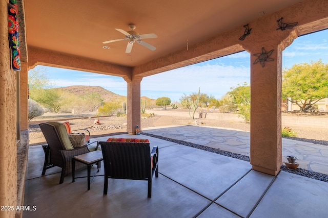 13050 W Pinnacle Vista Dr, Peoria, AZ 85383 - view of patio / terrace featuring a mountain view and ceiling fan