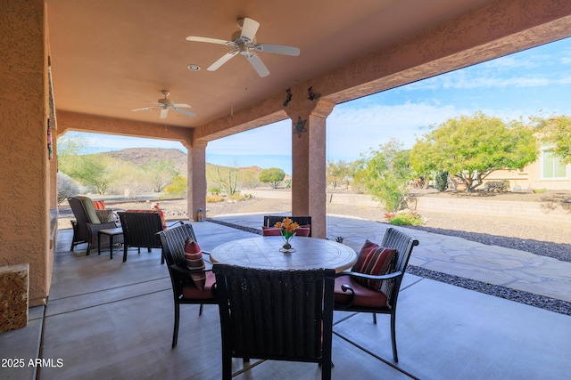 13050 W Pinnacle Vista Dr, Peoria, AZ 85383 - view of patio / terrace with ceiling fan and a mountain view