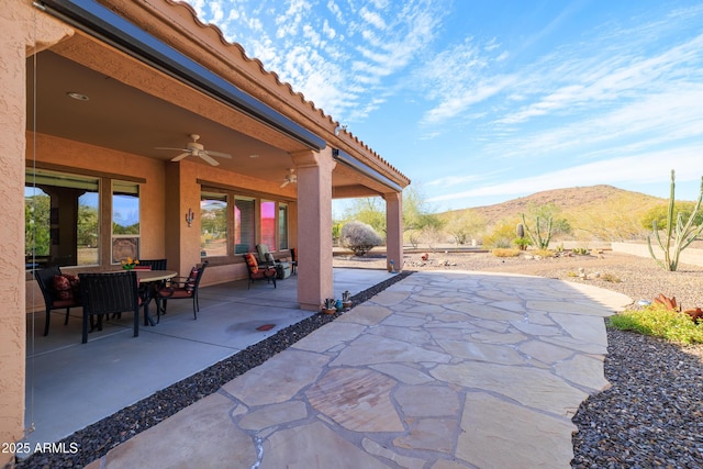 13050 W Pinnacle Vista Dr, Peoria, AZ 85383 - view of patio / terrace featuring a mountain view and ceiling fan