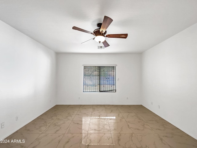 empty room featuring ceiling fan