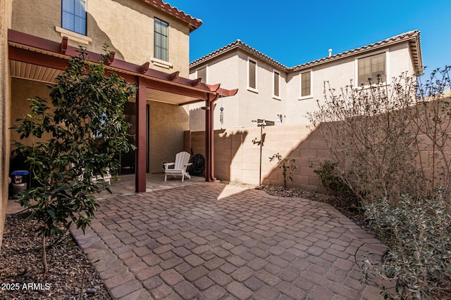 view of patio / terrace featuring fence