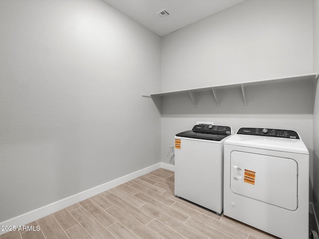 17621 W Pierson St, Goodyear, AZ 85395 - laundry room with independent washer and dryer, baseboards, and light wood finished floors