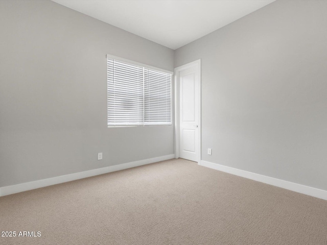 17621 W Pierson St, Goodyear, AZ 85395 - empty room with baseboards and light carpet