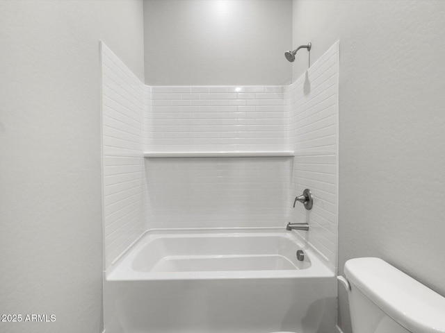 17621 W Pierson St, Goodyear, AZ 85395 - bathroom with a textured wall, shower / bath combination, and toilet