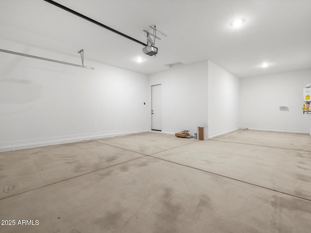 17621 W Pierson St, Goodyear, AZ 85395 - garage featuring a garage door opener, recessed lighting, water heater, and baseboards