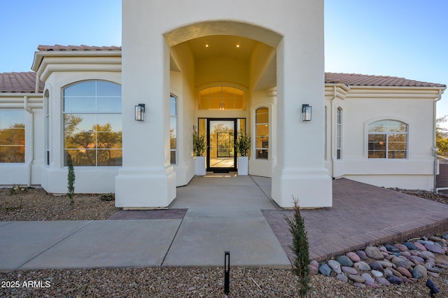 entrance to property featuring a patio area