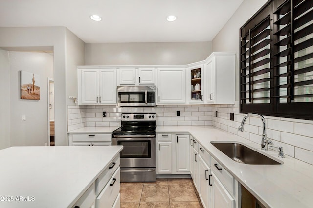 9350 W Williams St, Tolleson, AZ 85353 - kitchen featuring appliances with stainless steel finishes, light countertops, white cabinets, and recessed lighting