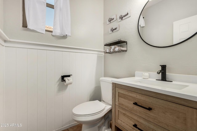 9350 W Williams St, Tolleson, AZ 85353 - half bathroom featuring vanity and a wainscoted wall