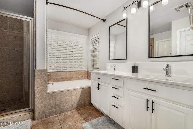 9350 W Williams St, Tolleson, AZ 85353 - bathroom with double vanity, a bath, tile patterned flooring, and a shower stall