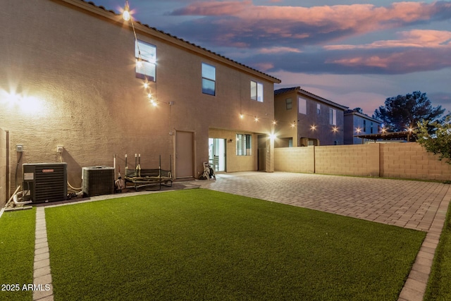 9350 W Williams St, Tolleson, AZ 85353 - back of house with a patio, a fenced backyard, and stucco siding