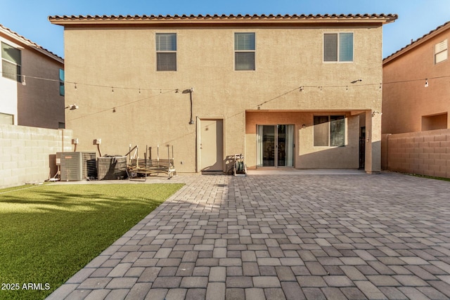 9350 W Williams St, Tolleson, AZ 85353 - rear view of house with a fenced backyard, a patio area, and stucco siding