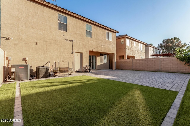 9350 W Williams St, Tolleson, AZ 85353 - rear view of property featuring stucco siding, a patio, and a fenced backyard