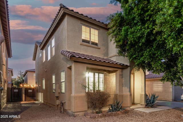 9350 W Williams St, Tolleson, AZ 85353 - view of front of home with a tile roof and stucco siding