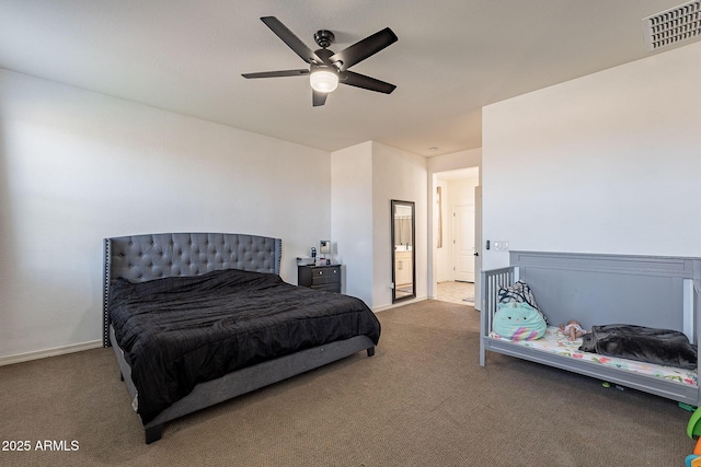 carpeted bedroom with ceiling fan, visible vents, and baseboards